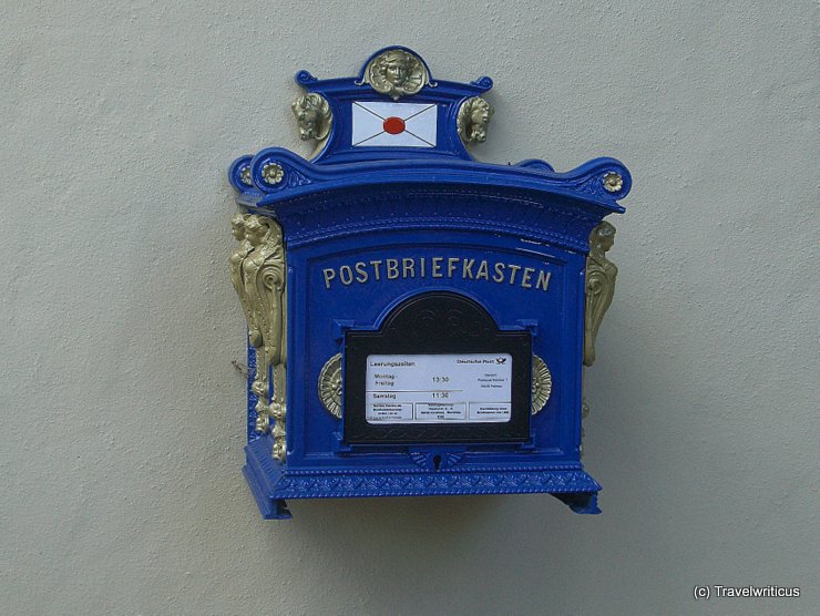 Blue postbox at a building in Frohnau