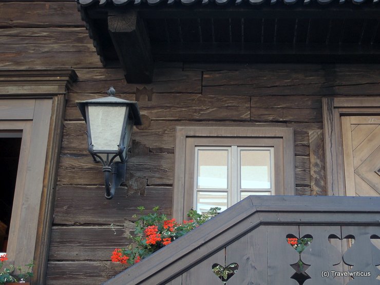 Wooden symbols at a building in Haus, Austria