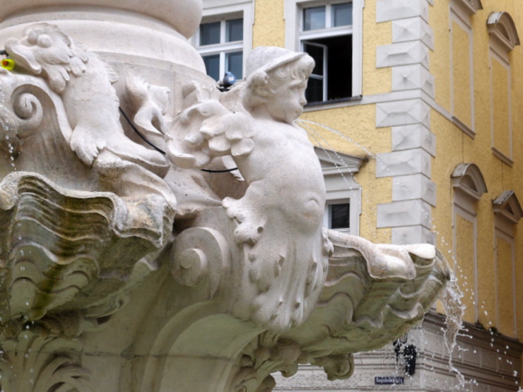 Angel wearing a Tyrolean hat at the Wittelsbach fountain in Passau, Germany