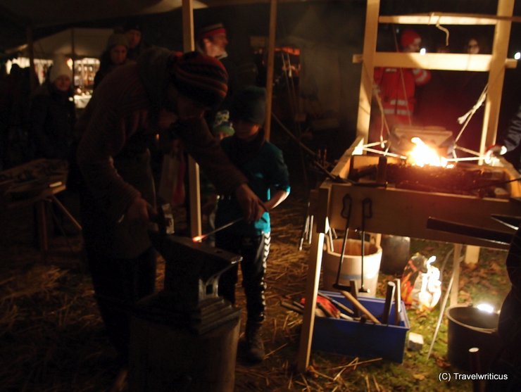 Smithy at the Christmas market of the Arsenal in Vienna, Austria