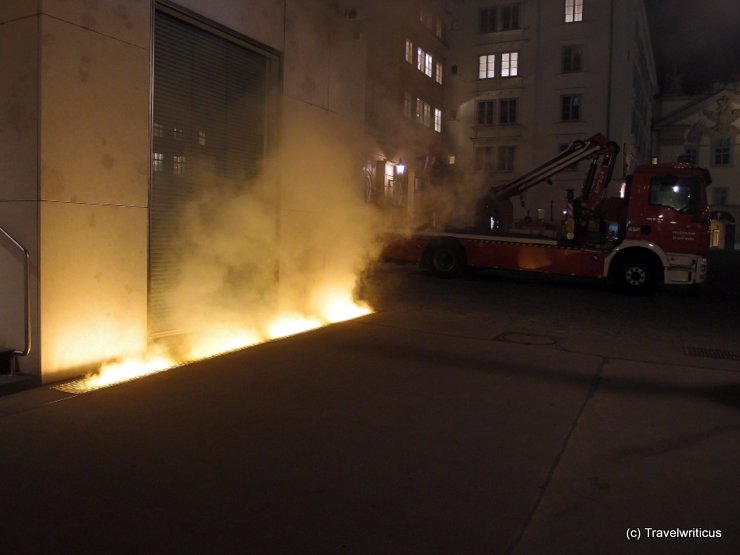 Truck of the fire brigade next to the yellow fog of Vienna